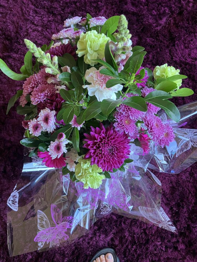 Berry Blush Bouquet - A vibrant hand-tied bouquet in rich pink, plum and soft green tones, beautifully arranged with seasonal flowers.