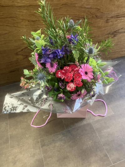 Pastel Harmony Gift Bag - A fresh arrangement of soft pink, white and lilac seasonal flowers presented in a stylish flower bag.